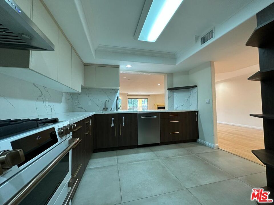 Interior, Kitchen, Marble Walls, Recessed Lighting, Stainless Steel Appliances, Wood Texture Flooring