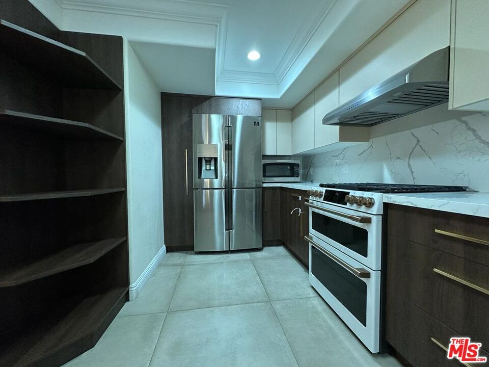 Interior, Kitchen, Marble Walls, Recessed Lighting, Stainless Steel Appliances