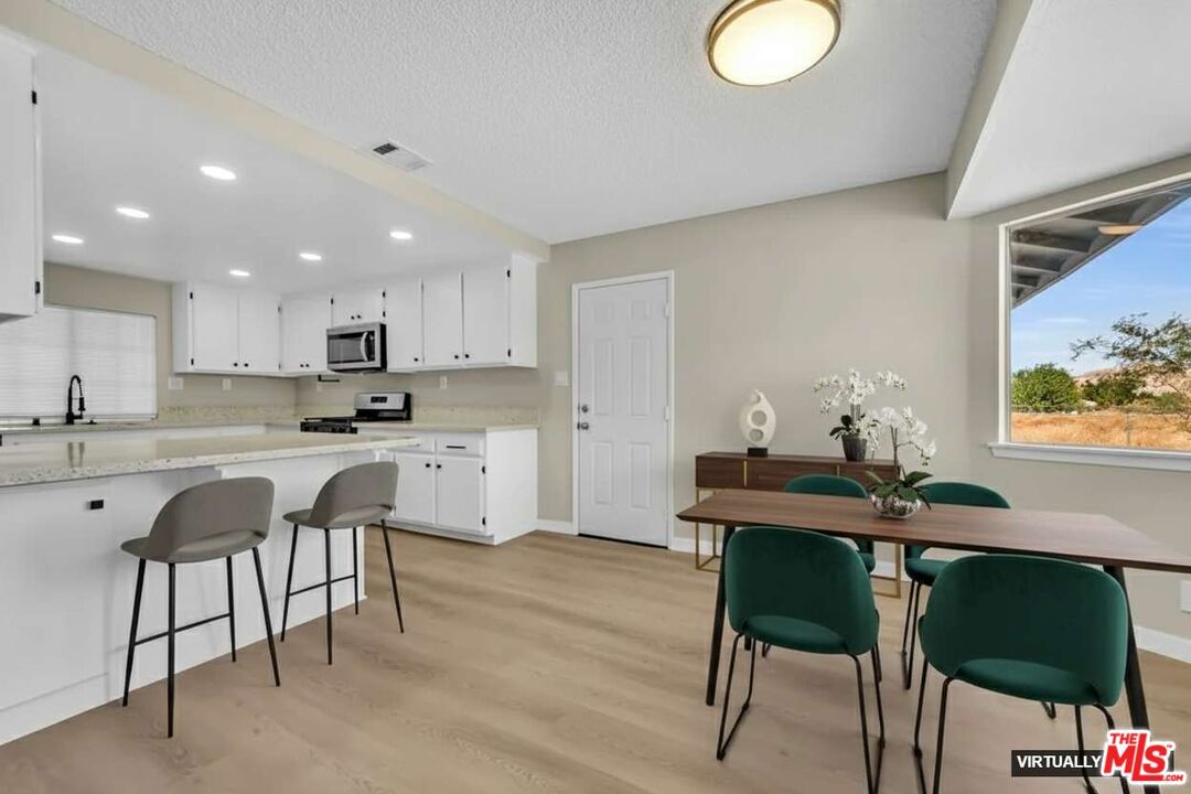 Dining room, Interior, Kitchen, Recessed Lighting, Stainless Steel Appliances, Wood Texture Flooring
