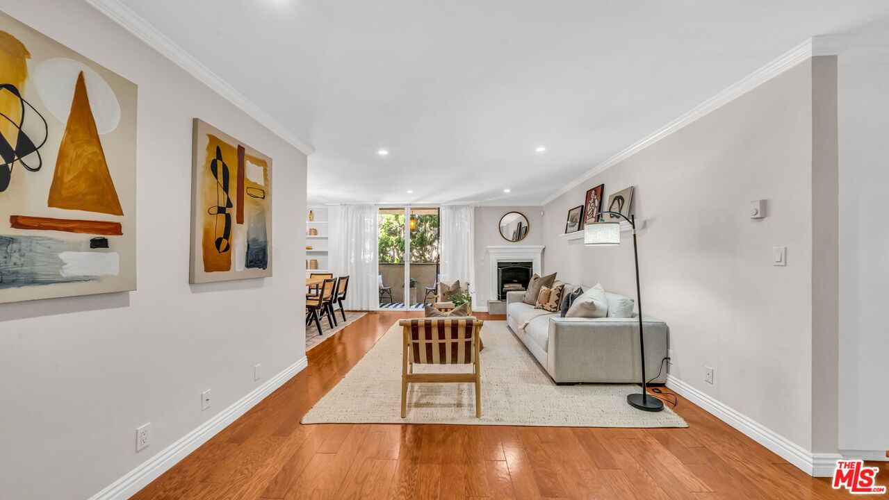Dining room, Fireplace, Interior, Living room, Recessed Lighting, Wood Texture Flooring