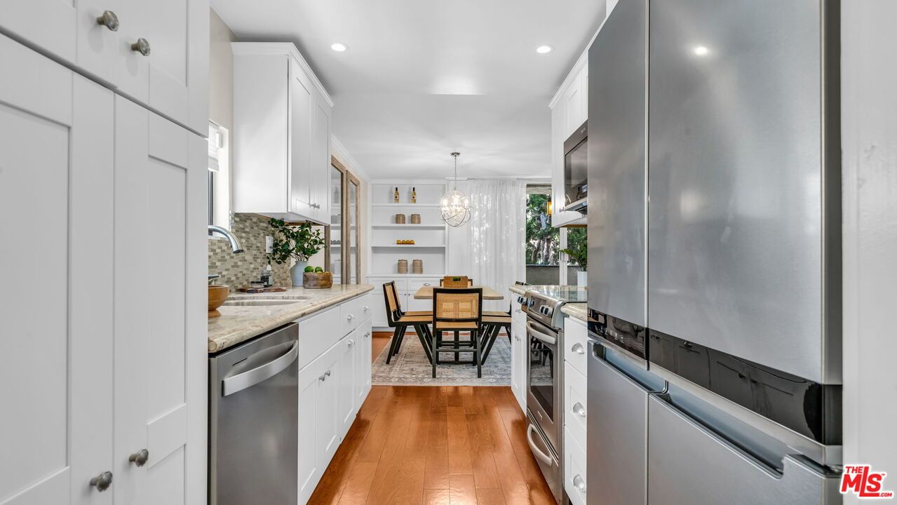 Chandelier, Dining room, Interior, Kitchen, Recessed Lighting, Stainless Steel Appliances, Wood Texture Flooring