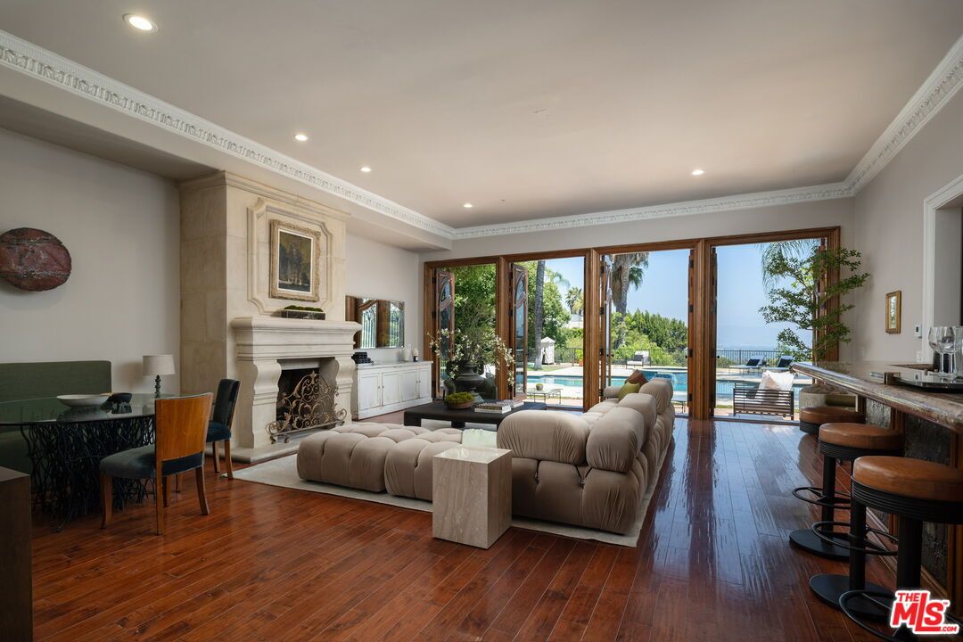 Dining room, Fireplace, Interior, Living room, Recessed Lighting, Wood Texture Flooring