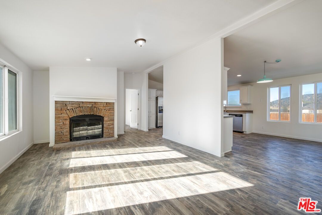Empty room, Fireplace, Interior, Pendant Lights, Recessed Lighting, Wood Texture Flooring