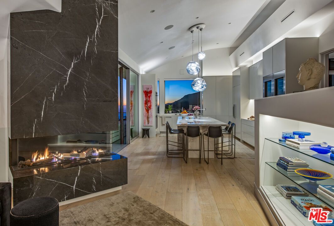 Dining room, Fireplace, Interior, Marble Walls, Pendant Lights, Recessed Lighting, Wood Texture Flooring