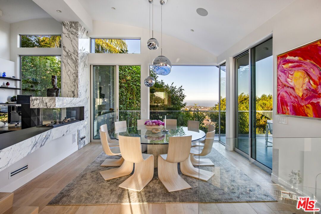Dining room, Fireplace, Interior, Pendant Lights, Recessed Lighting, Water, Wood Texture Flooring