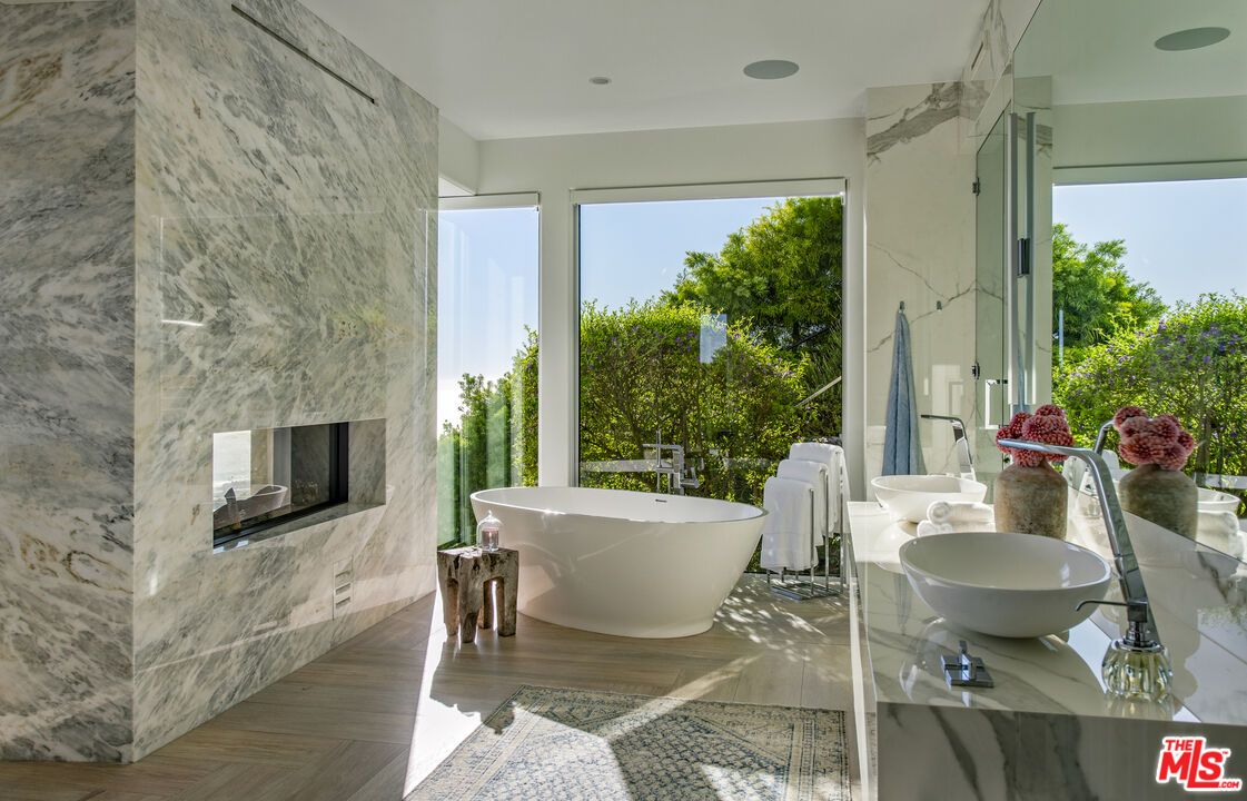 Bathroom, Fireplace, Free Standing Baths, Interior, Marble Walls, Recessed Lighting, Wood Texture Flooring