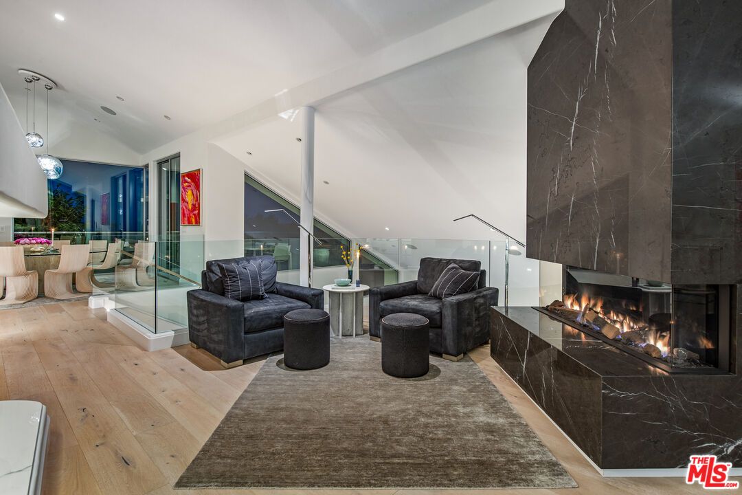 Fireplace, Interior, Living room, Marble Walls, Pendant Lights, Recessed Lighting, Wood Texture Flooring