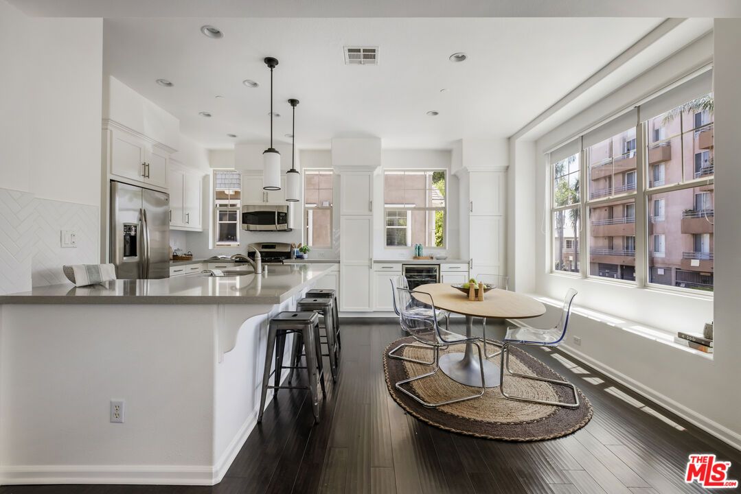 Dining room, Interior, Kitchen, Pendant Lights, Recessed Lighting, Stainless Steel Appliances, Wood Texture Flooring