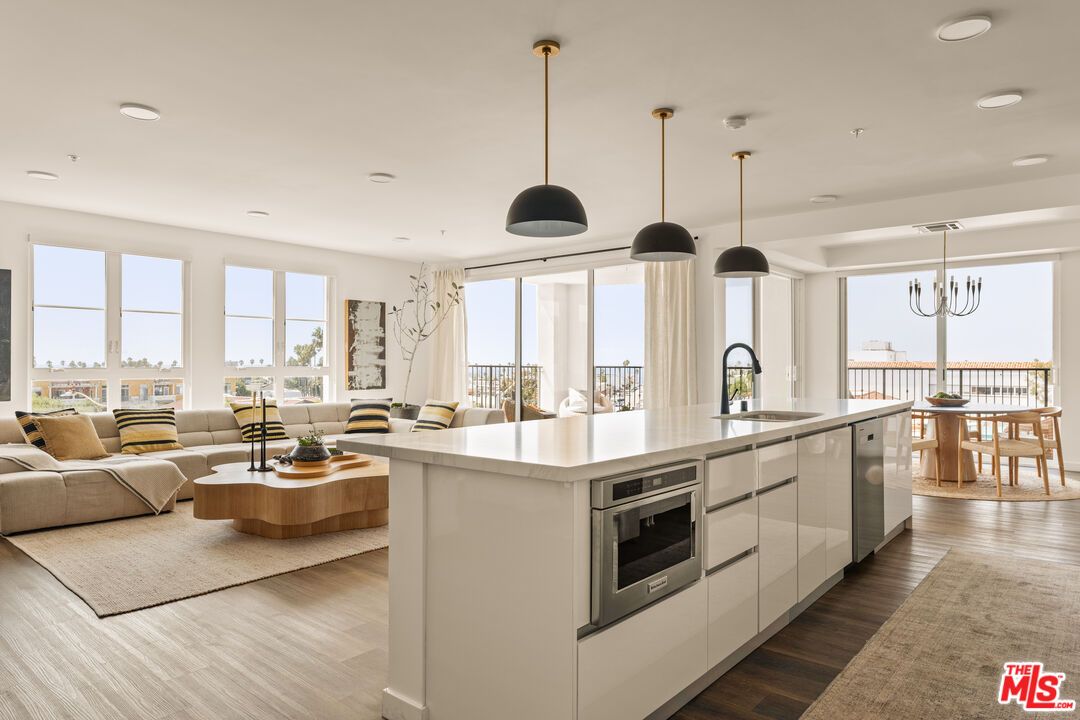 Dining room, Interior, Kitchen, Living room, Pendant Lights, Recessed Lighting, Stainless Steel Appliances, Wood Texture Flooring