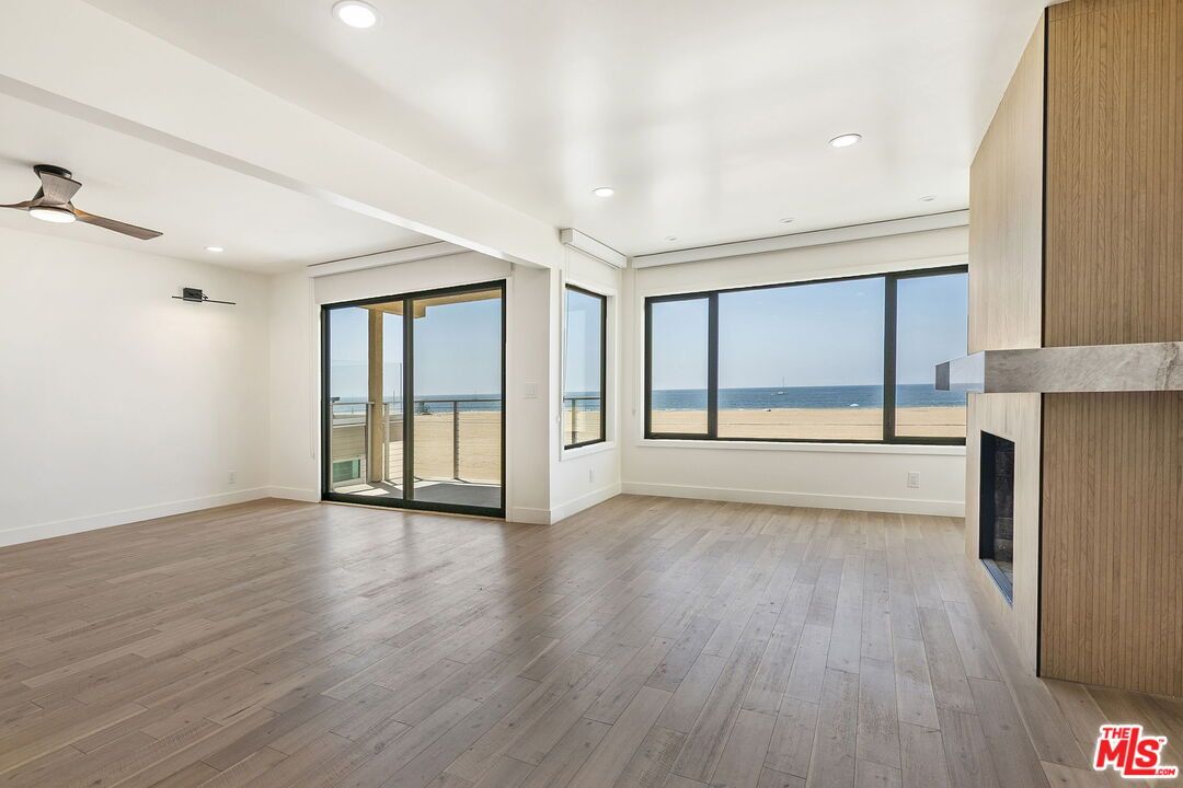 Empty room, Fireplace, Interior, Recessed Lighting, Water, Wood Texture Flooring