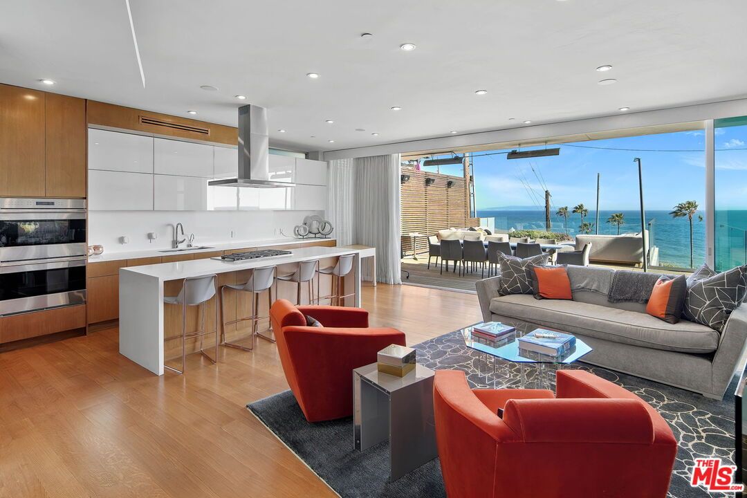 Dining room, Interior, Kitchen, Living room, Recessed Lighting, Stainless Steel Appliances, Water, Wood Texture Flooring