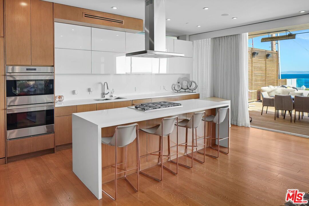 Dining room, Interior, Kitchen, Recessed Lighting, Stainless Steel Appliances, Water, Wood Texture Flooring