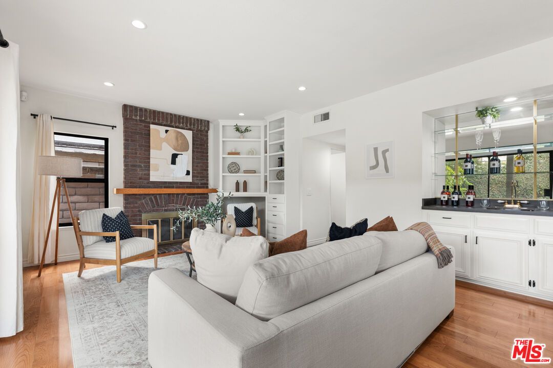 Fireplace, Interior, Living room, Recessed Lighting, Stone Walls, Wood Texture Flooring