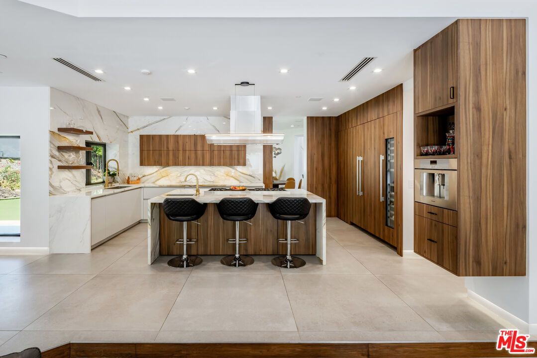 Interior, Kitchen, Marble Walls, Recessed Lighting, Stainless Steel Appliances
