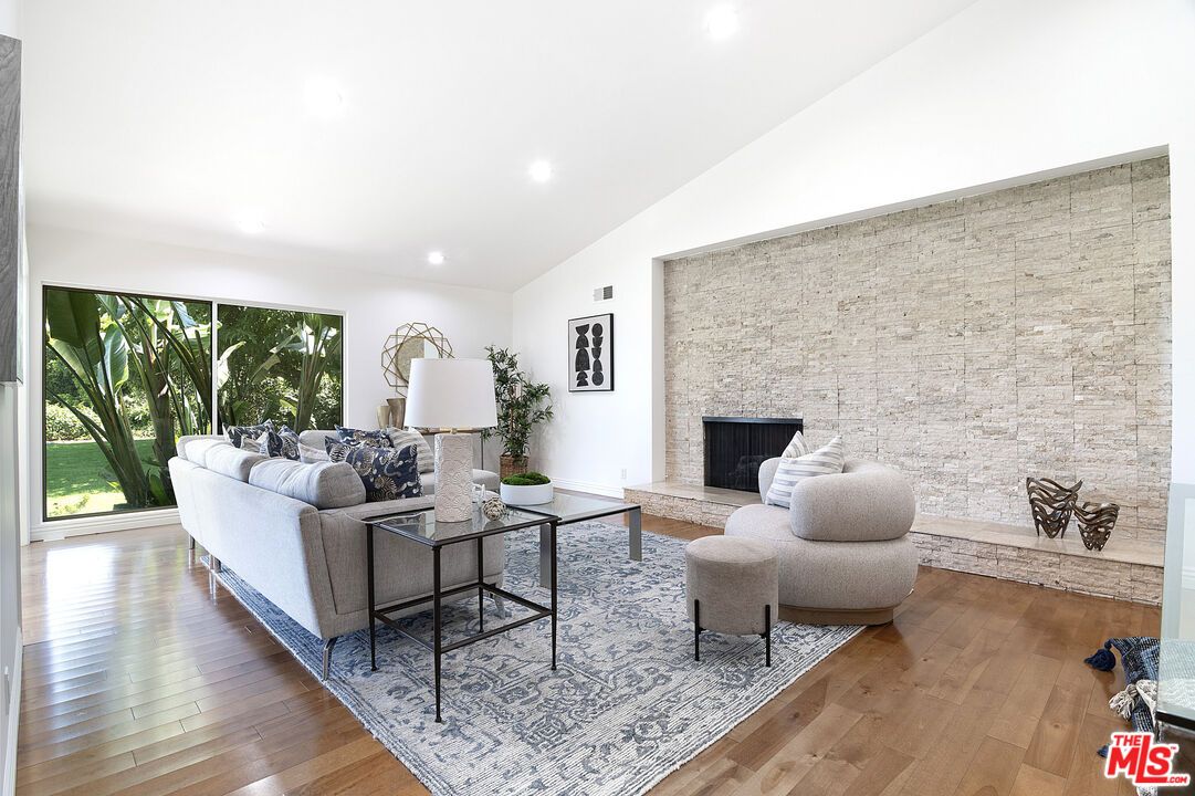 Fireplace, Interior, Living room, Recessed Lighting, Stone Walls, Wood Texture Flooring