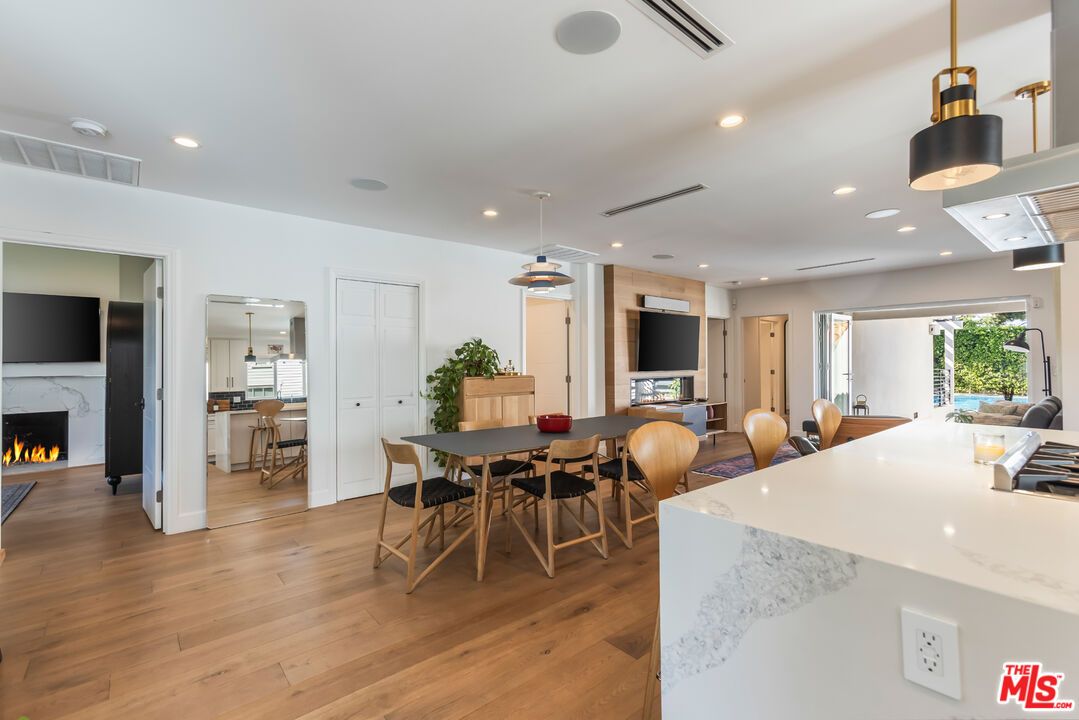 Dining room, Fireplace, Interior, Kitchen, Pendant Lights, Recessed Lighting, Wood Texture Flooring