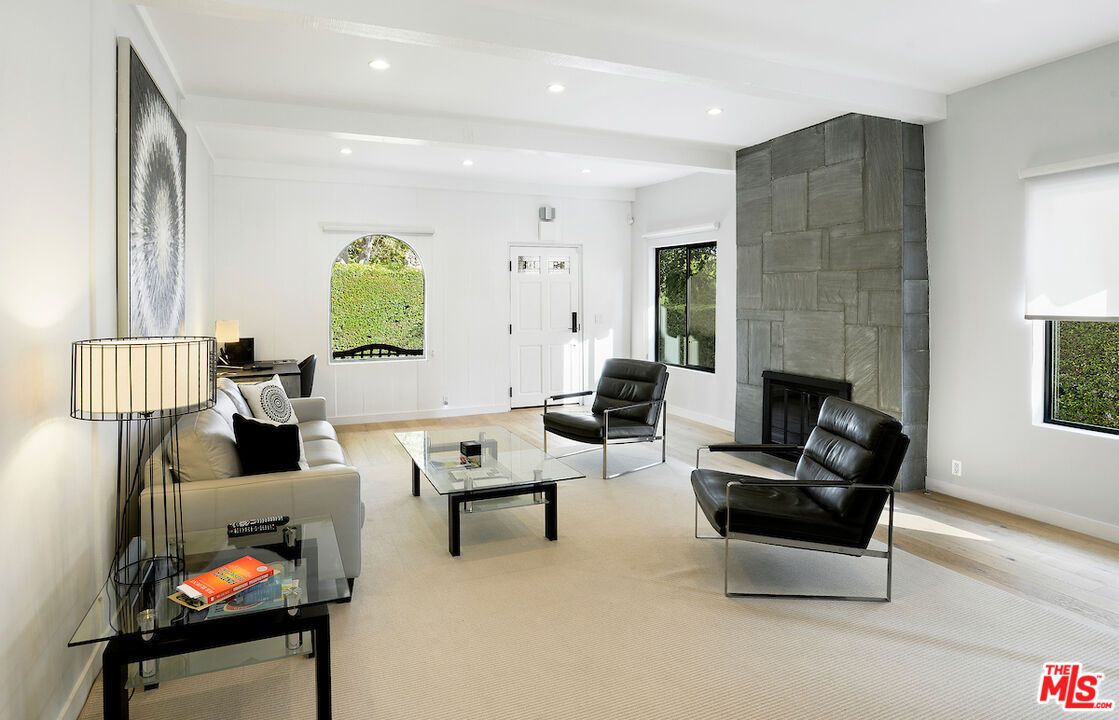 Fireplace, Interior, Living room, Recessed Lighting, Stone Walls, Wood Texture Flooring