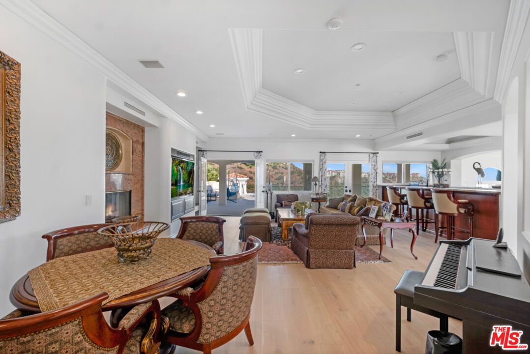 Dining room, Fireplace, Interior, Living room, Piano, Recessed Lighting, Wood Texture Flooring