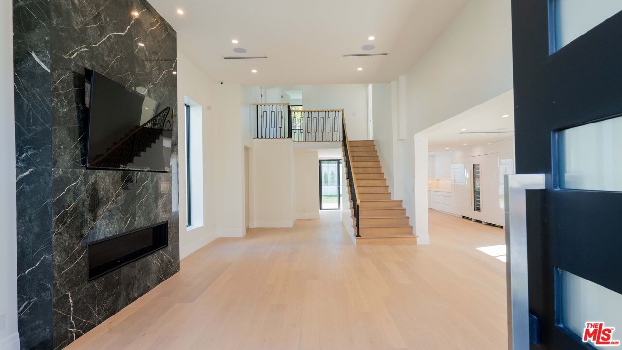 Fireplace, Interior, Marble Walls, Recessed Lighting, Wood Texture Flooring