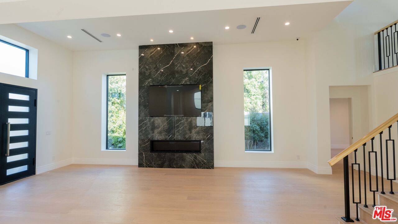 Fireplace, Interior, Marble Walls, Recessed Lighting, Wood Texture Flooring