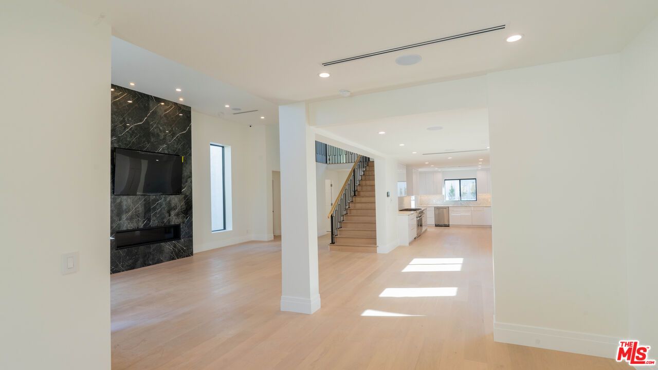 Fireplace, Interior, Marble Walls, Recessed Lighting, Wood Texture Flooring