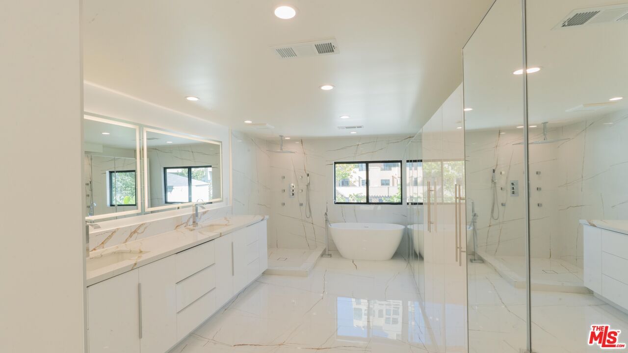 Bathroom, Dual Sink Vanities, Free Standing Baths, Glass Shower, Interior, Marble, Marble Walls, Recessed Lighting