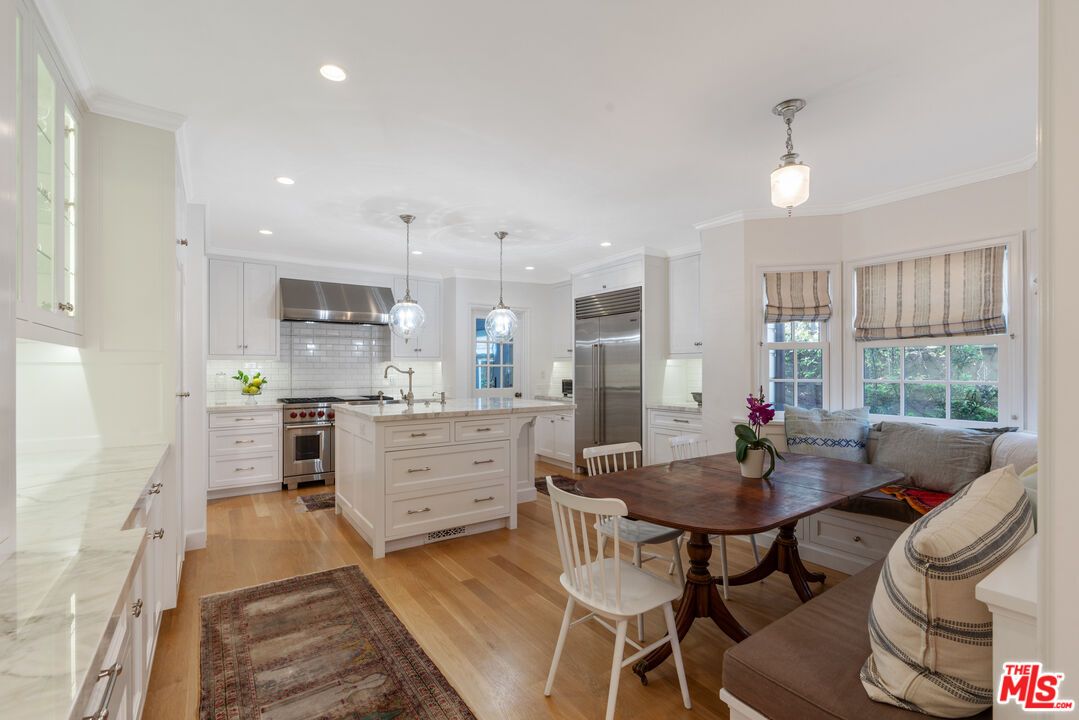 Dining room, Interior, Kitchen, Pendant Lights, Recessed Lighting, Stainless Steel Appliances, Wood Texture Flooring