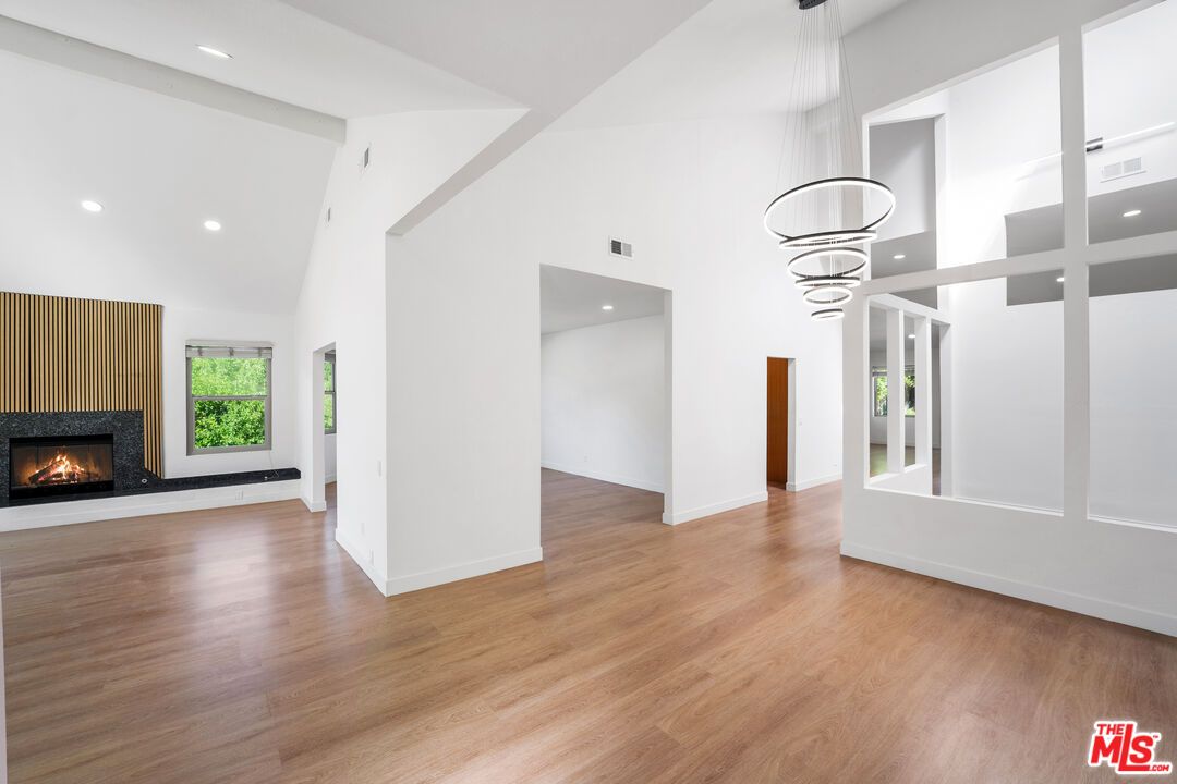 Fireplace, Interior, Pendant Lights, Recessed Lighting, Wood Texture Flooring