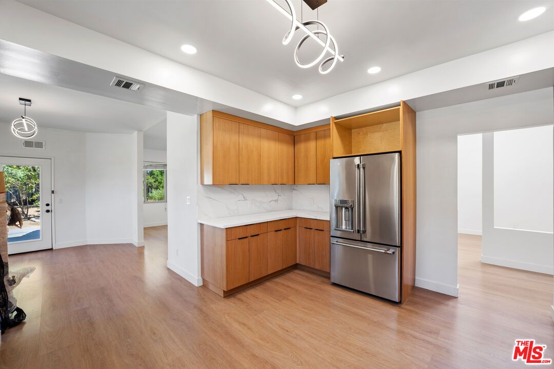 Interior, Kitchen, Marble Walls, Pendant Lights, Recessed Lighting, Stainless Steel Appliances, Wood Texture Flooring