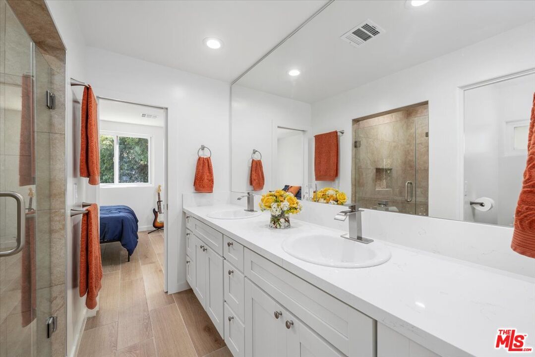 Bathroom, Dual Sink Vanities, Glass Shower, Interior, Recessed Lighting, Wood Texture Flooring