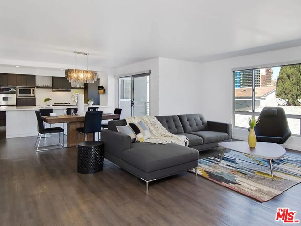 Chandelier, Dining room, Interior, Kitchen, Living room, Stainless Steel Appliances, Wood Texture Flooring
