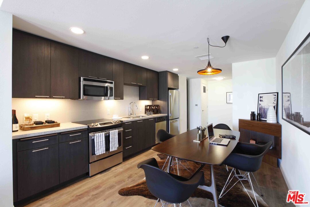 Dining room, Interior, Kitchen, Pendant Lights, Recessed Lighting, Stainless Steel Appliances, Wood Texture Flooring