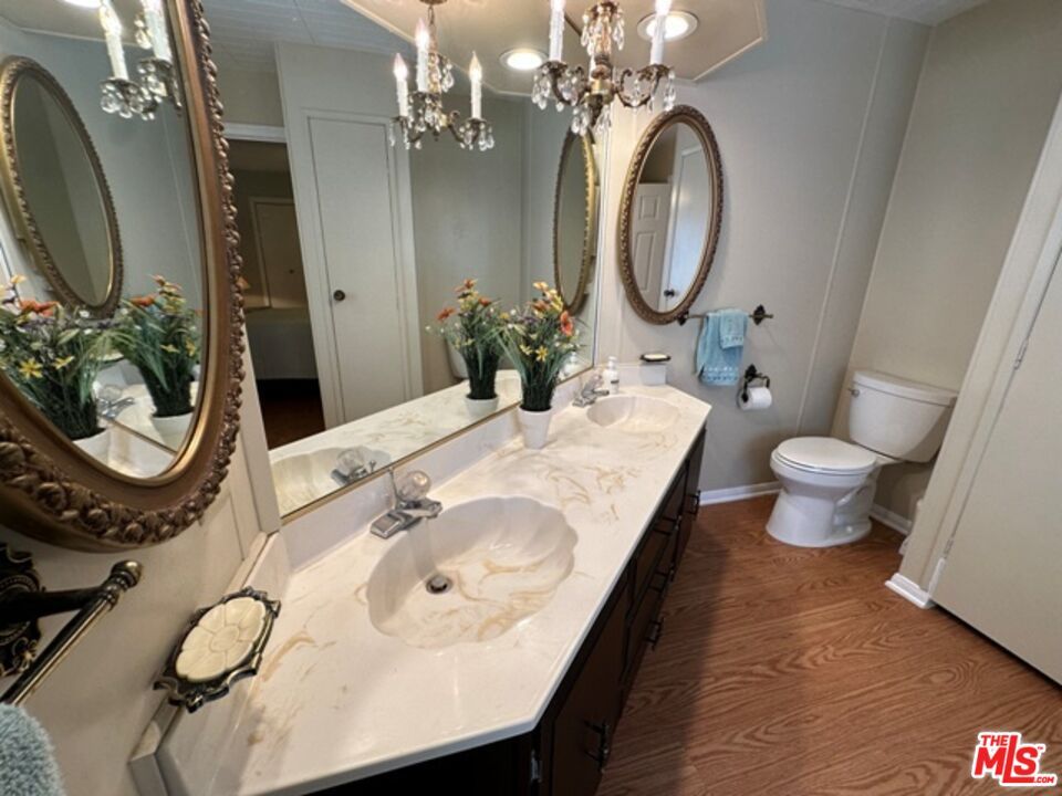 Bathroom, Chandelier, Dual Sink Vanities, Interior, Recessed Lighting, Wood Texture Flooring