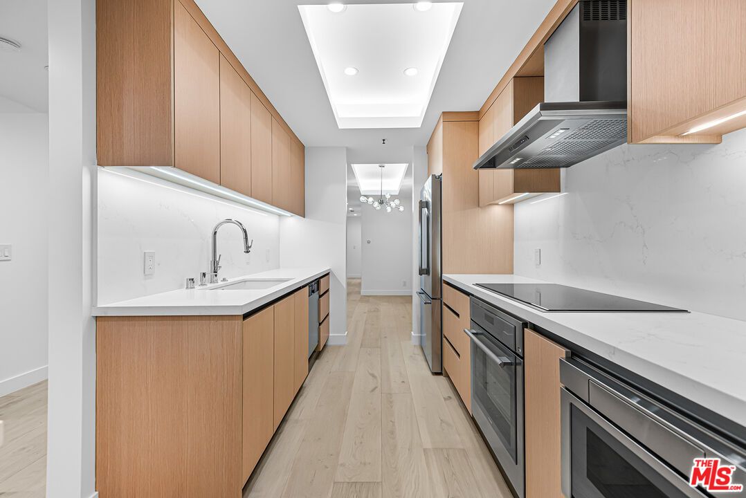 Interior, Kitchen, Marble Walls, Recessed Lighting, Stainless Steel Appliances, Wood Texture Flooring