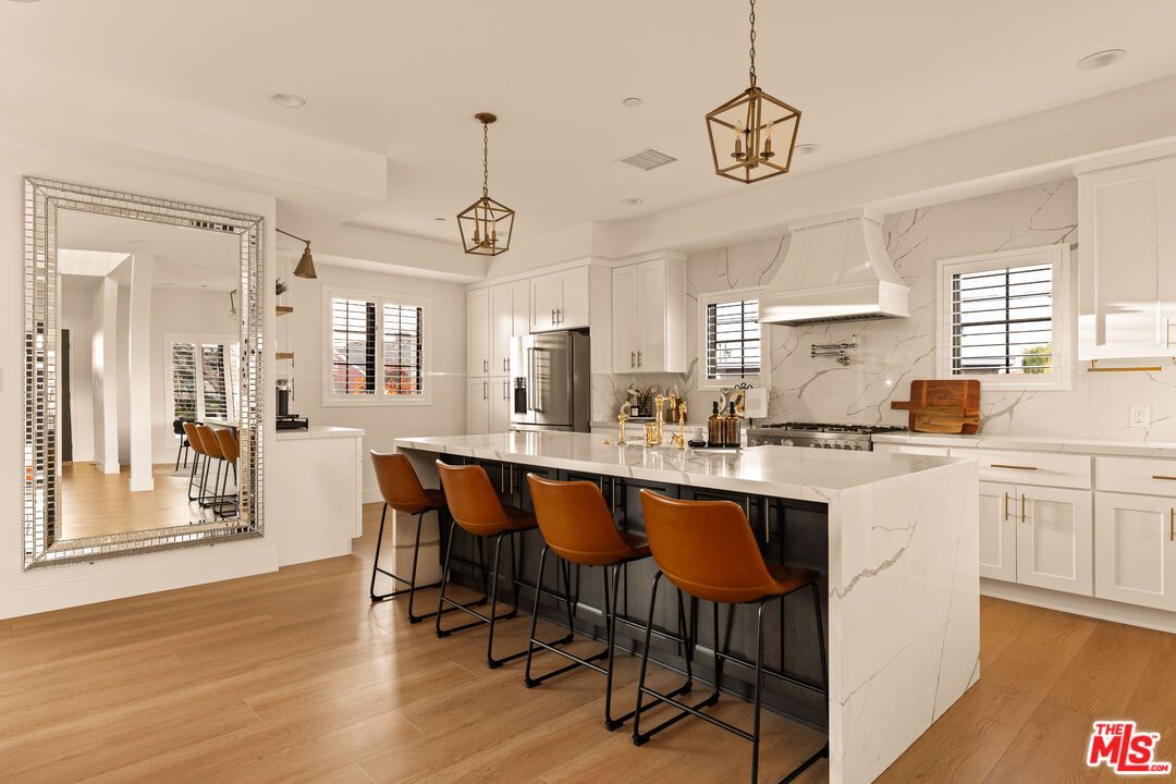 Interior, Kitchen, Marble Walls, Pendant Lights, Recessed Lighting, Stainless Steel Appliances, Wood Texture Flooring