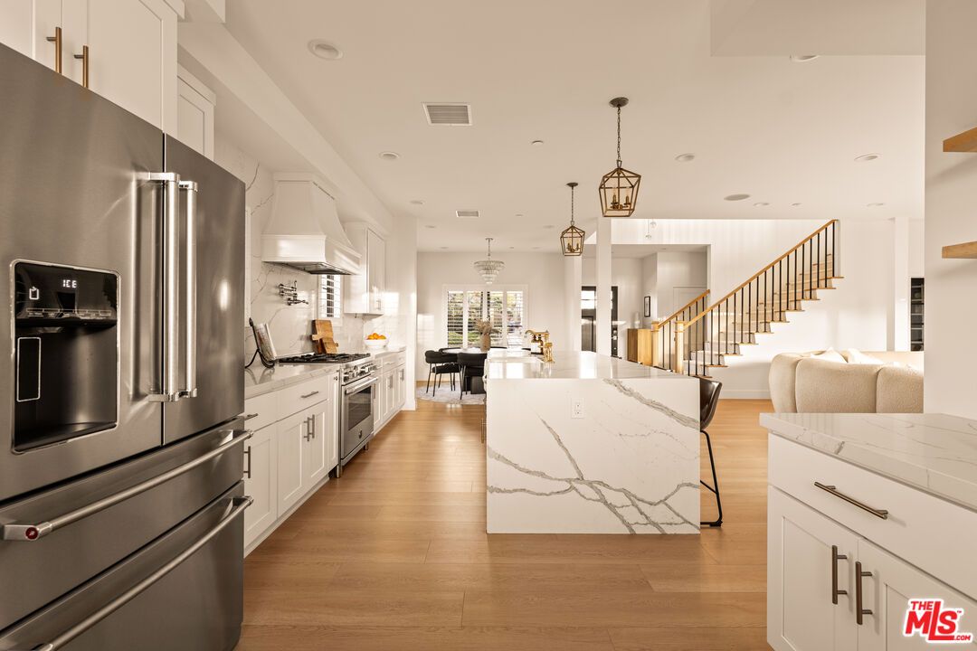 Dining room, Interior, Kitchen, Pendant Lights, Recessed Lighting, Stainless Steel Appliances, Wood Texture Flooring