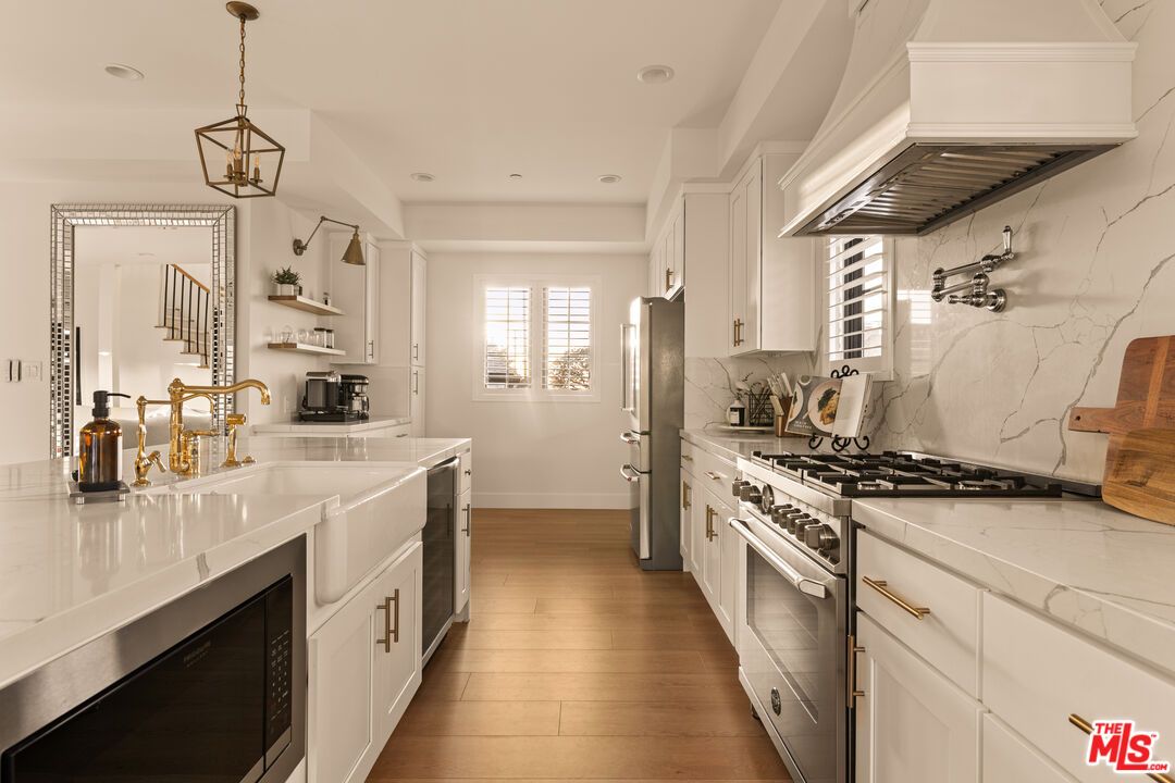 Interior, Kitchen, Marble Walls, Pendant Lights, Recessed Lighting, Stainless Steel Appliances, Wood Texture Flooring