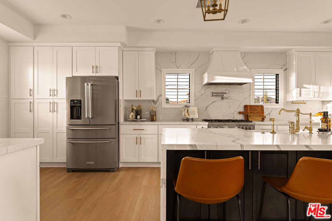 Interior, Kitchen, Marble Walls, Recessed Lighting, Stainless Steel Appliances, Wood Texture Flooring