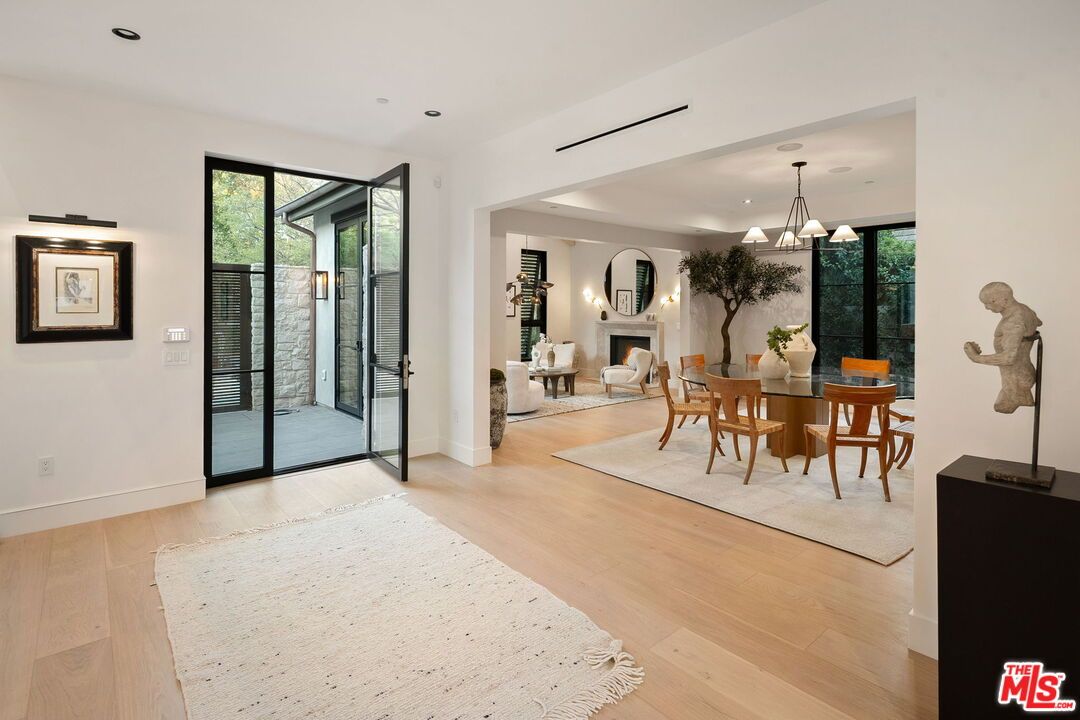 Dining room, Fireplace, Interior, Living room, Pendant Lights, Recessed Lighting, Wood Texture Flooring