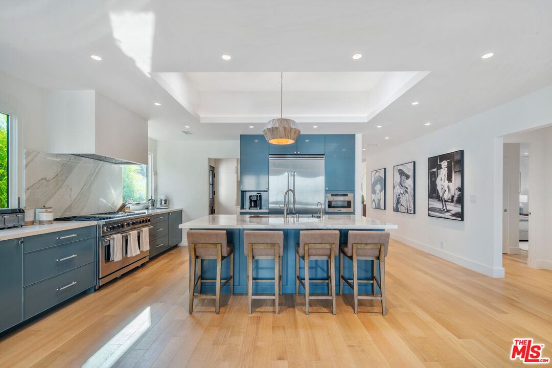 Interior, Kitchen, Marble Walls, Pendant Lights, Recessed Lighting, Stainless Steel Appliances, Wood Texture Flooring