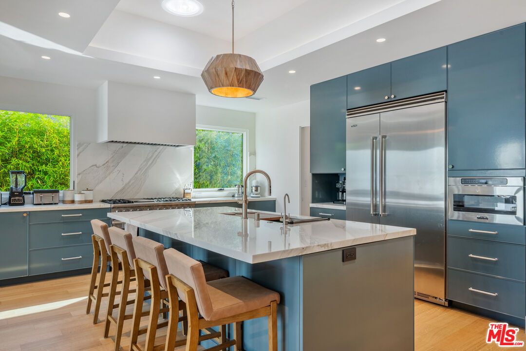 Interior, Kitchen, Marble Walls, Pendant Lights, Recessed Lighting, Stainless Steel Appliances, Wood Texture Flooring