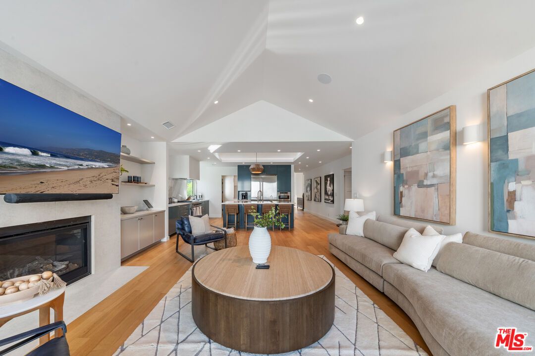 Dining room, Fireplace, Interior, Kitchen, Living room, Pendant Lights, Recessed Lighting, Stainless Steel Appliances, Wood Texture Flooring