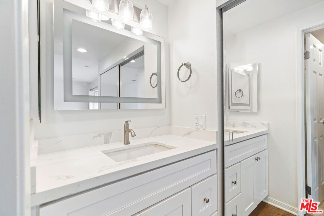 Bathroom, Dual Sink Vanities, Interior, Recessed Lighting, Wood Texture Flooring