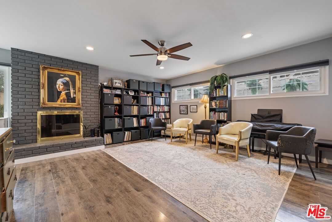 Fireplace, Interior, Living room, Recessed Lighting, Stone Walls, Wood Texture Flooring