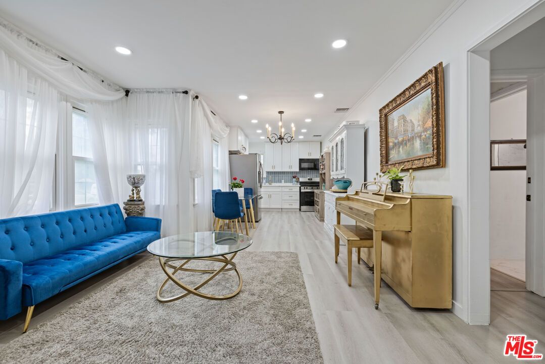 Interior, Kitchen, Pendant Lights, Piano, Recessed Lighting, Stainless Steel Appliances, Wood Texture Flooring