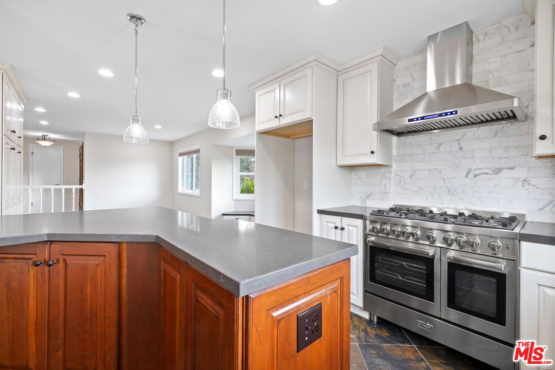 Interior, Kitchen, Marble Walls, Pendant Lights, Recessed Lighting, Stainless Steel Appliances
