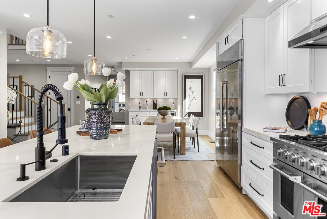 Dining room, Interior, Kitchen, Pendant Lights, Recessed Lighting, Stainless Steel Appliances, Wood Texture Flooring