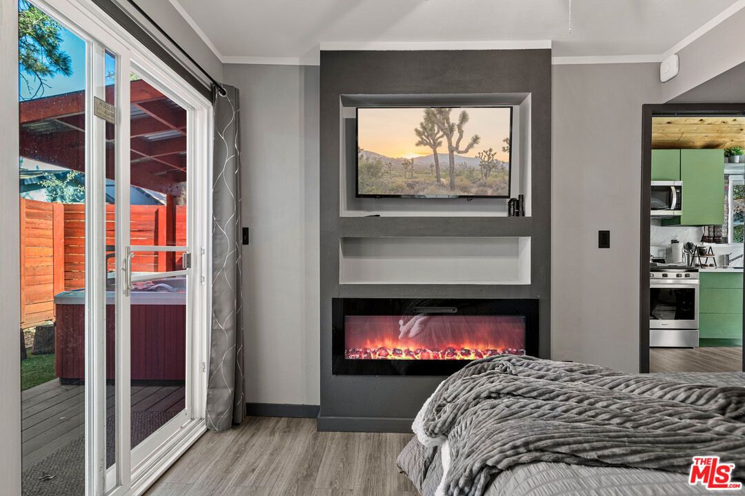 Bedroom, Fireplace, Interior, Stainless Steel Appliances, Wood Texture Flooring