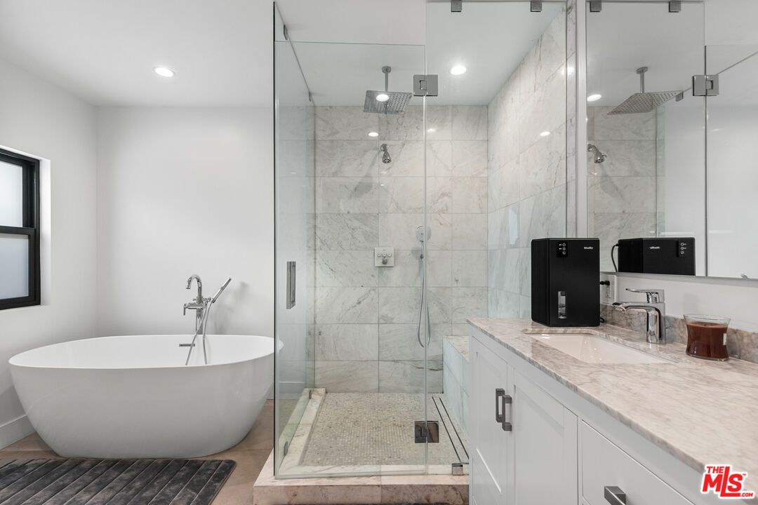 Bathroom, Dual Sink Vanities, Free Standing Baths, Glass Shower, Interior, Marble Walls, Recessed Lighting