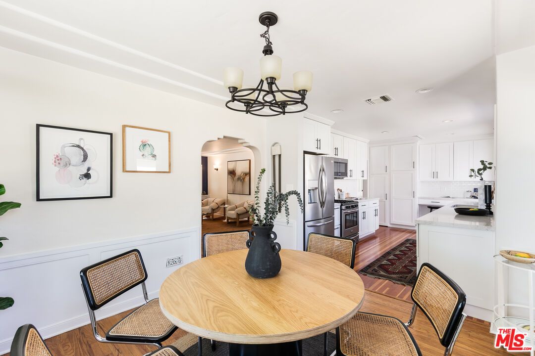 Chandelier, Dining room, Interior, Kitchen, Recessed Lighting, Stainless Steel Appliances, Wood Texture Flooring